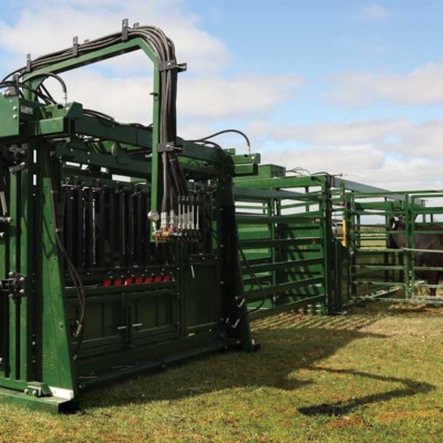 hydraulic cattle squeeze chute in field