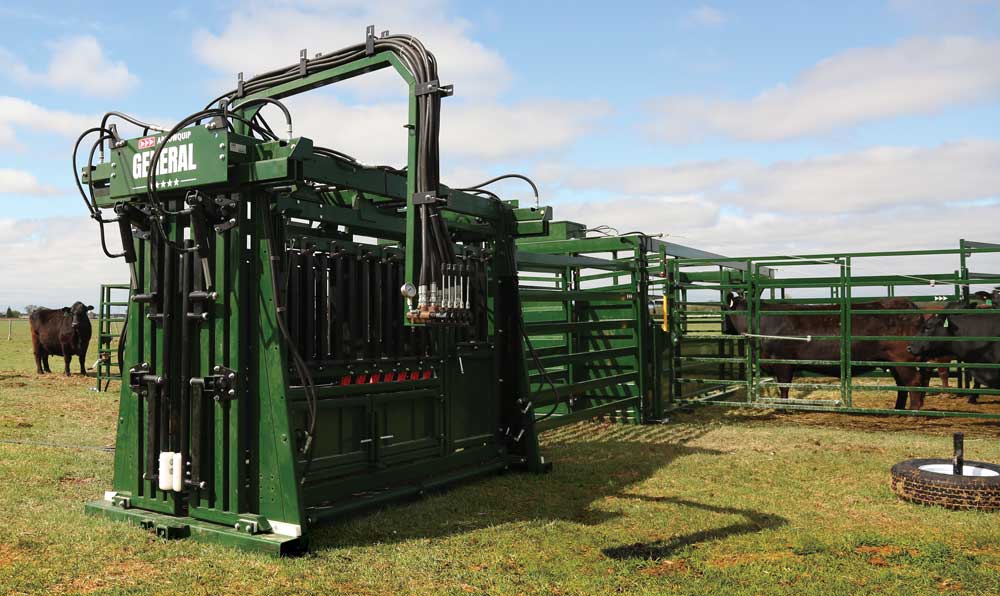 hydraulic cattle squeeze chute in field